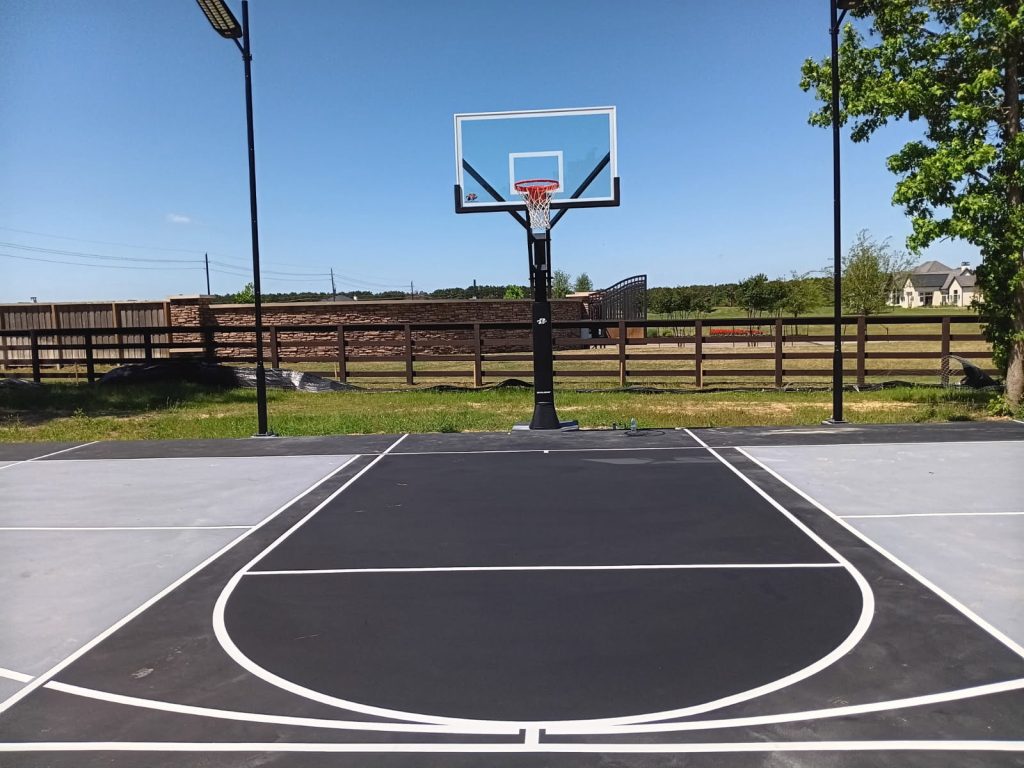 Houston backyard sports court in black and grey for basketball and pickleball