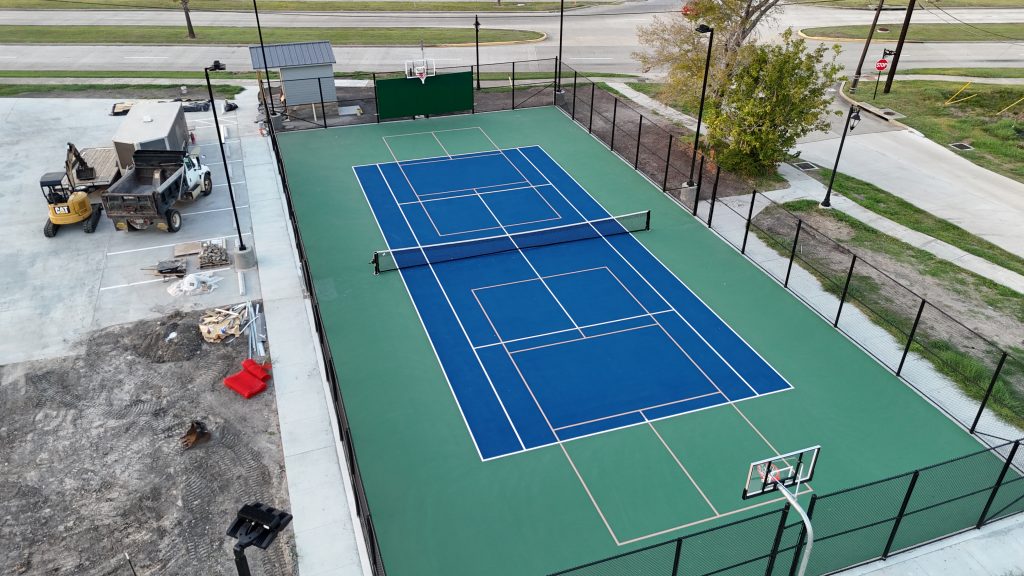 Evening view of Morgon's Point multi-court with LED lighting, featuring pickleball, tennis, and basketball