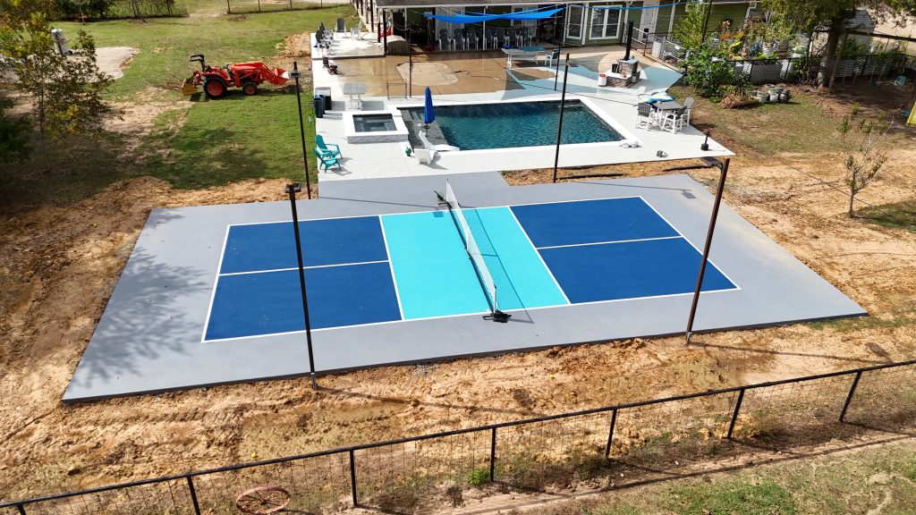 Pickleball court construction project near Houston Texas with blue surface