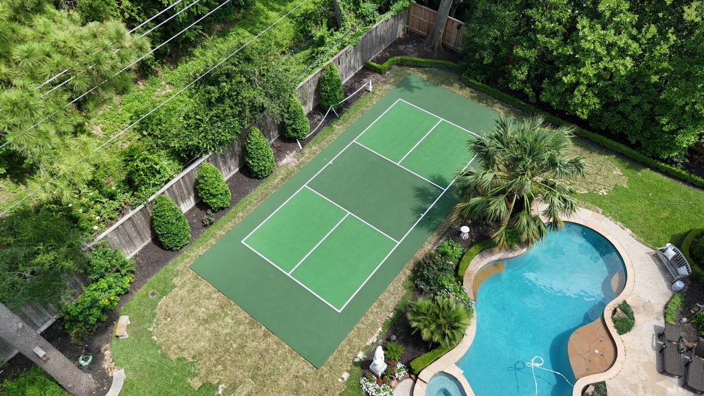 Green residential pickleball court in Houston built by Build My Courts with professional playing surface and proper court dimensions